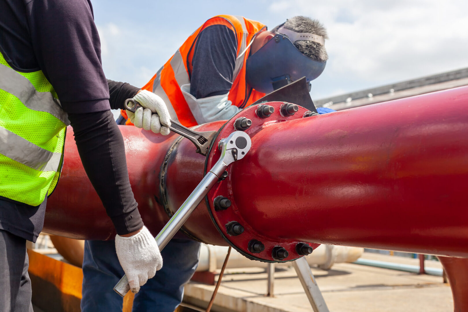 Worker install Tightening bolts &amp; Nuts of piping Flange system. In the industrial plant.